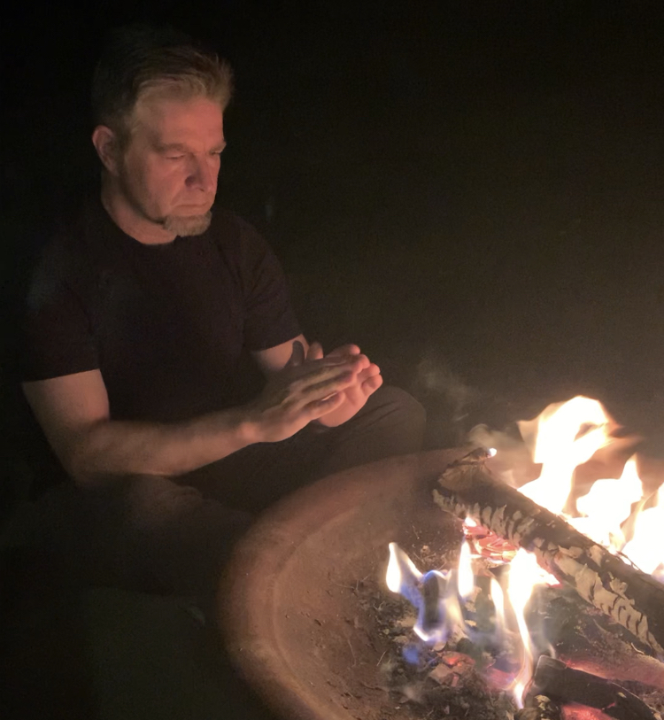 Me warming my hands by the fire.