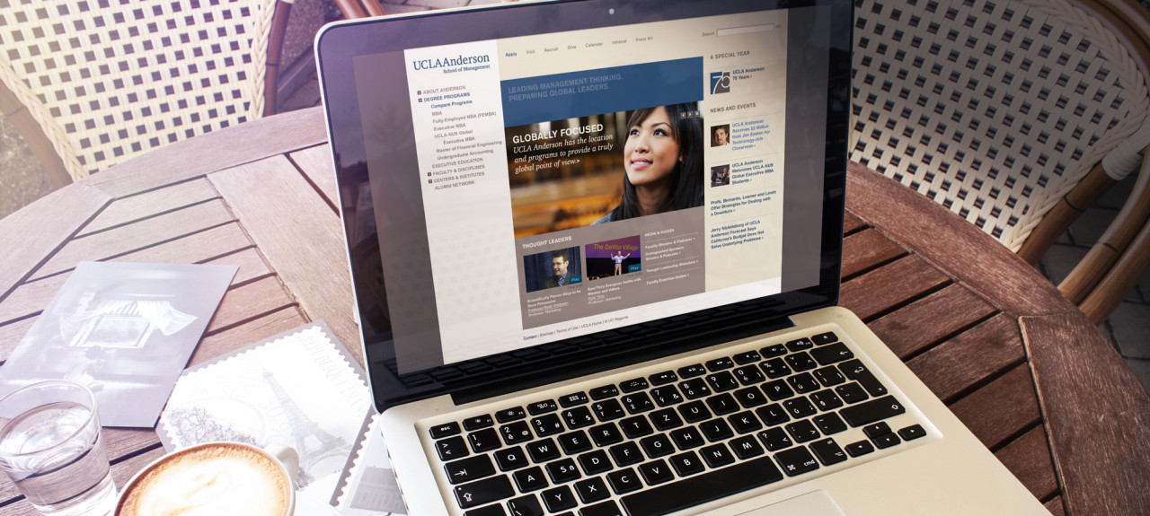 A lovely shot of a laptop open to the UCLA Anderson website.