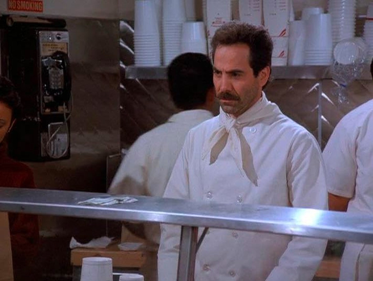 The soup nazi from Seinfeld is scowling.